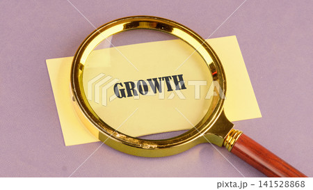 Golden handheld tool focusing on business development progress and market expansion strategy written on a small rectangular sticky note during a daytime desk review Golden handheld tool focusing on business development progress and market expansion strategy written on a small rectangular sticky note during a daytime desk review 141528868