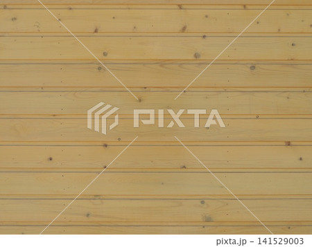A smooth wooden wall made of horizontally sanded boards of a light, yellowish-beige hue. The natural grain pattern and dark knots are visible on the wood's surface. A smooth wooden wall made of horizontally sanded boards of a light, yellowish-beige hue. The natural grain pattern and dark knots are visible on the wood's surface. 141529003