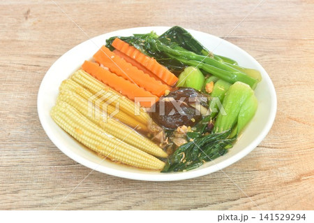 fried mixed vegetable dressing sesame oil and soy sauce with chop garlic on plate fried mixed vegetable dressing sesame oil and soy sauce with chop garlic on plate 141529294