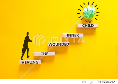 Healing the wounded inner child symbol. Concept words Healing the wounded inner child on beautiful wooden blocks. Beautiful yellow background. Psychological Healing inner child concept. Copy space. Healing the wounded inner child symbol. Concept words Healing the wounded inner child on beautiful wooden blocks. Beautiful yellow background. Psychological Healing inner child concept. Copy space. 141530342