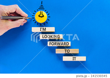 I'm looking forward to it symbol. Concept words I'm looking forward to it on beautiful wooden blocks. Beautiful blue background. Light bulb. Business and I'm looking forward to it concept. Copy space. I'm looking forward to it symbol. Concept words I'm looking forward to it on beautiful wooden blocks. Beautiful blue background. Light bulb. Business and I'm looking forward to it concept. Copy space. 141530345