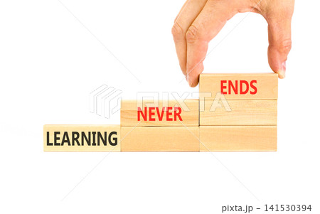 Learning never ends words symbol. Concept words Learning never ends on beautiful wooden blocks. Beautiful white background. Business support motivational and learning never ends concept. Copy space. Learning never ends words symbol. Concept words Learning never ends on beautiful wooden blocks. Beautiful white background. Business support motivational and learning never ends concept. Copy space. 141530394