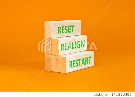 Reset realign restart words symbol. Concept words Reset realign restart on beautiful wooden blocks. Beautiful orange background. Business motivational and reset realign restart concept. Copy space. Reset realign restart words symbol. Concept words Reset realign restart on beautiful wooden blocks. Beautiful orange background. Business motivational and reset realign restart concept. Copy space. 141530395