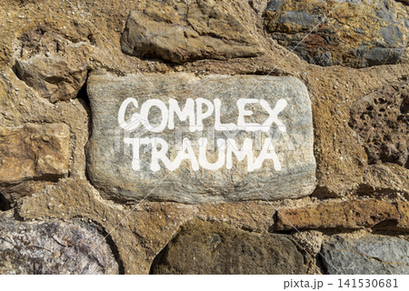 Complex trauma words symbol. Concept words Complex trauma on beautiful grey stone. Beautiful stone wall background. Psychological complex trauma support concept. Copy space. Complex trauma words symbol. Concept words Complex trauma on beautiful grey stone. Beautiful stone wall background. Psychological complex trauma support concept. Copy space. 141530681