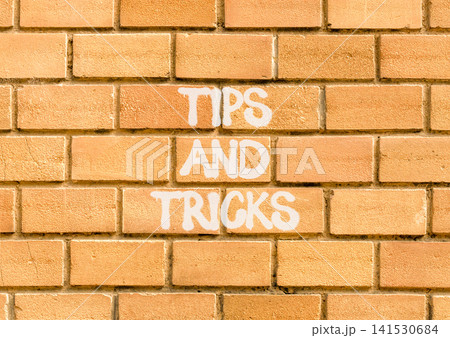 Tips and tricks words symbol. Concept words Tips and tricks on beautiful brick wall. Beautiful brick wall background. Business tips and tricks motivational support concept. Copy space. Tips and tricks words symbol. Concept words Tips and tricks on beautiful brick wall. Beautiful brick wall background. Business tips and tricks motivational support concept. Copy space. 141530684