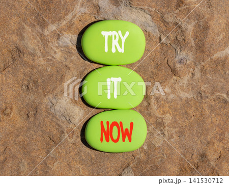 Try it now words symbol. Concept words Try is now on beautiful green stones. Beautiful stone background. Business support motivational and try is now concept. Copy space. Try it now words symbol. Concept words Try is now on beautiful green stones. Beautiful stone background. Business support motivational and try is now concept. Copy space. 141530712
