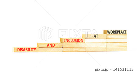 Disability and inclusion symbol. Concept words Disability and inclusion at workplace on beautiful wooden blocks. Beautiful white background. Disability and inclusion at workplace concept. Copy space. 141531113