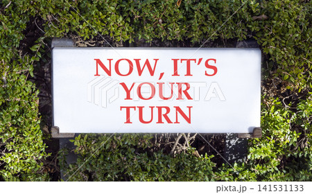 Now it's your turn words symbol. Concept words Now it's your turn on beautiful white sign plate. Beautiful green trees background. Business Now it's your turn motivational support concept Copy space 141531133