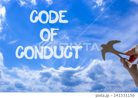 Code of conduct words symbol. Concept words Code of conduct on beautiful blue sky. Beautiful blue sky background. Wooden bird. Businessman hand. Business Code of conduct concept. Copy space. Code of conduct words symbol. Concept words Code of conduct on beautiful blue sky. Beautiful blue sky background. Wooden bird. Businessman hand. Business Code of conduct concept. Copy space. 141531150