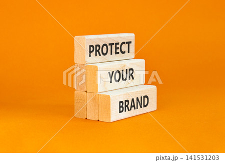 Protect your brand words symbol. Concept words Protect your brand on beautiful wooden blocks. Beautiful orange background. Business and protect your brand concept. Copy space. Protect your brand words symbol. Concept words Protect your brand on beautiful wooden blocks. Beautiful orange background. Business and protect your brand concept. Copy space. 141531203