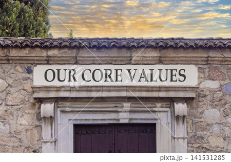 Our core values words symbol. Concept words Our core values on beautiful white sign plate. Beautiful stone wall background. Business our core values motivational support concept. Copy space. Our core values words symbol. Concept words Our core values on beautiful white sign plate. Beautiful stone wall background. Business our core values motivational support concept. Copy space. 141531285
