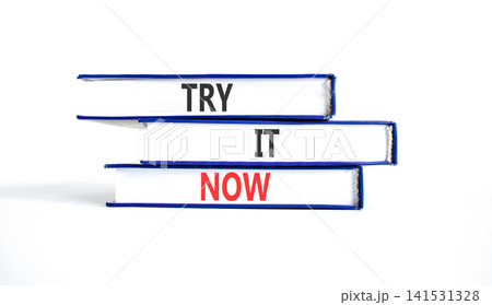 Try it now words symbol. Concept words Try is now on beautiful books. Beautiful white background. Business support motivational and try is now concept. Copy space. Try it now words symbol. Concept words Try is now on beautiful books. Beautiful white background. Business support motivational and try is now concept. Copy space. 141531328