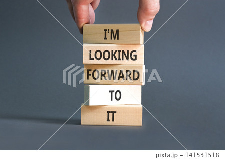I'm looking forward to it symbol. Concept words I'm looking forward to it on beautiful wooden blocks. Beautiful grey background. Business and I'm looking forward to it concept. Copy space. 141531518