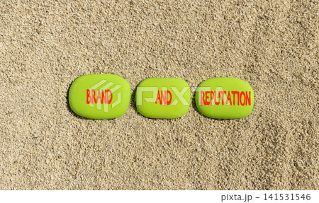 Brand and reputation words symbol. Concept words Brand and reputation on beautiful green stones. Beautiful sand background. Business brand and reputation concept. Copy space. Brand and reputation words symbol. Concept words Brand and reputation on beautiful green stones. Beautiful sand background. Business brand and reputation concept. Copy space. 141531546