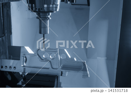High-precision 5-axis CNC milling machine cutting an aerospace part with a flat nose end mill tool. High-precision 5-axis CNC milling machine cutting an aerospace part with a flat nose end mill tool. 141531718