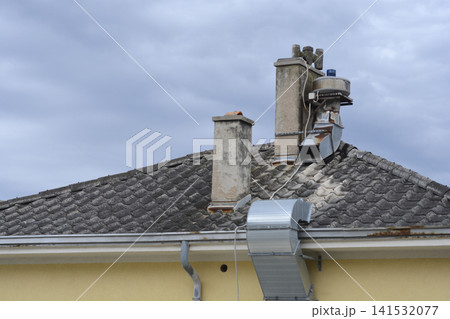 Old Roof Tiled Surface with Chimneys and Ventilation Outlet Old Roof Tiled Surface with Chimneys and Ventilation Outlet 141532077