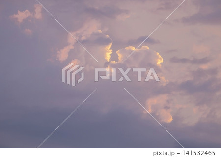 Soft pink and purple clouds at sunset. Fluffy cumulus clouds in the sky. Soft pink and purple clouds at sunset. Fluffy cumulus clouds in the sky. 141532465