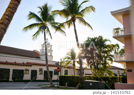 White Clock Tower Building Framed By Tall Palm Trees At Sunrise White Clock Tower Building Framed By Tall Palm Trees At Sunrise 141533762