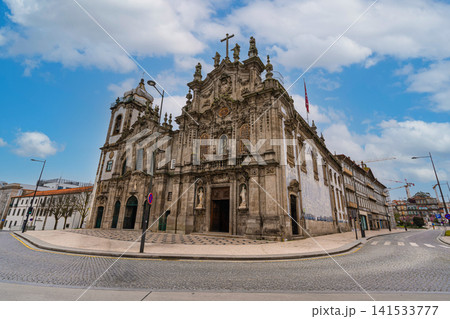 Baroque church facade with azulejo tiles and tourists in Porto Baroque church facade with azulejo tiles and tourists in Porto 141533777