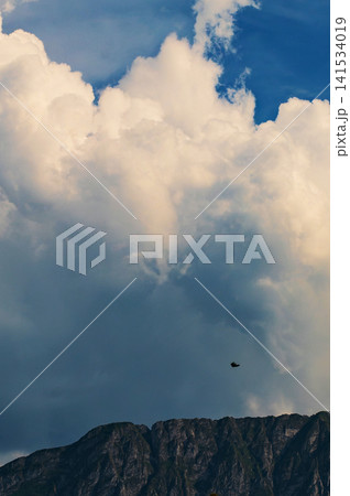 Dramatic Cumulonimbus Storm Clouds Above Mountain Forest Dramatic Cumulonimbus Storm Clouds Above Mountain Forest 141534019