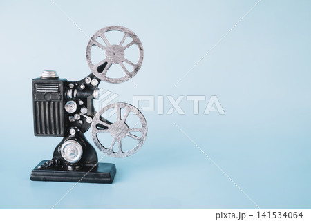 Vintage Film Projector on Blue Background with Copy Space 141534064