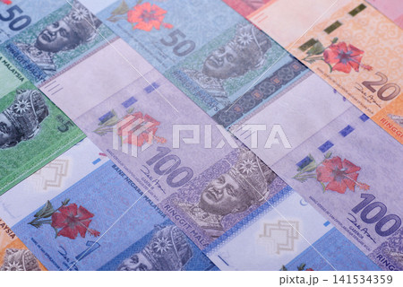 Malaysian ringgit banknotes as a tool for trade and financial transactions. The Malaysian ringgit Malaysian ringgit banknotes as a tool for trade and financial transactions. The Malaysian ringgit 141534359