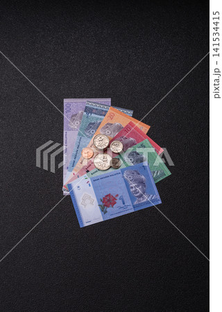 Malaysian ringgit banknotes as a tool for trade and financial transactions. The Malaysian ringgit Malaysian ringgit banknotes as a tool for trade and financial transactions. The Malaysian ringgit 141534415