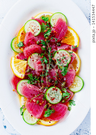 Sicilian tuna crudo, on a white plate, Italian dish, homemade, no people, Sicilian tuna crudo, on a white plate, Italian dish, homemade, no people, 141534447