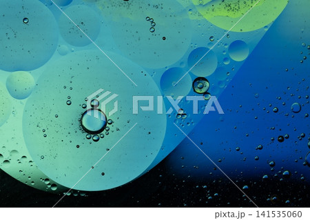 Oil drops on water surface creating colorful abstract texture 141535060