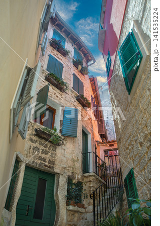 Colorful vintage windows and stone walls in Rovinj, Croatia. Colorful vintage windows and stone walls in Rovinj, Croatia. 141535224