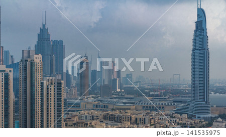 Dubai Downtown night to day timelapse. Aerial view over big futuristic city by night. 141535975