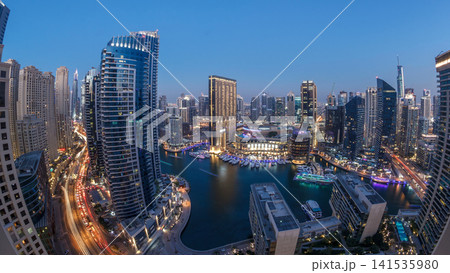 Evening illumination of Dubai Marina day to night aerial timelapse, UAE. Evening illumination of Dubai Marina day to night aerial timelapse, UAE. 141535980