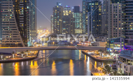Beautiful aerial top view day to night transition timelapse of Dubai Marina canal Beautiful aerial top view day to night transition timelapse of Dubai Marina canal 141535994