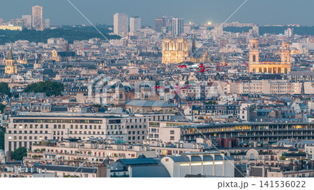 Aerial panorama above houses rooftops in a Paris day to night timelapse 141536022