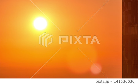 Sunrise close up view over Dubai skyline in the morning, aerial top view from downtown timelapse. Sunrise close up view over Dubai skyline in the morning, aerial top view from downtown timelapse. 141536036