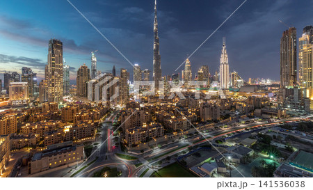 Dubai Downtown skyline day to night timelapse with Burj Khalifa and other towers panoramic view from the top in Dubai Dubai Downtown skyline day to night timelapse with Burj Khalifa and other towers panoramic view from the top in Dubai 141536038