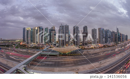 Aerial top view to Sheikh Zayed road near Dubai Marina and JLT day to night timelapse, Dubai. 141536056