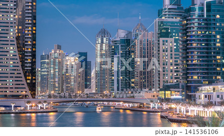 Dubai Marina towers and canal in Dubai day to night timelapse Dubai Marina towers and canal in Dubai day to night timelapse 141536106