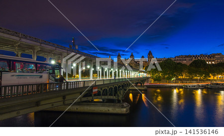 View of pont de Bir-Hakeim day to night timelapse - a bridge that crosses the Seine River. Paris, France View of pont de Bir-Hakeim day to night timelapse - a bridge that crosses the Seine River. Paris, France 141536146