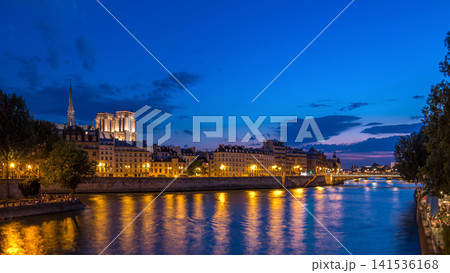 Le Pont D'Arcole bridge after sunset with people and boats day to night timelapse, Paris, France, Europe Le Pont D'Arcole bridge after sunset with people and boats day to night timelapse, Paris, France, Europe 141536168