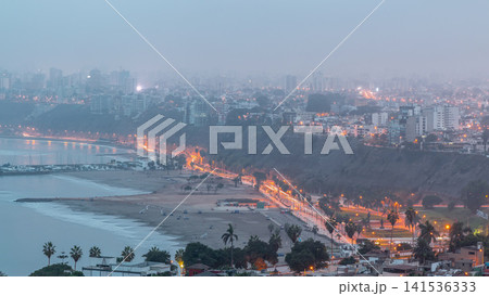Aerial view of Lima's shoreline including the districts of Barranco and Chorrillos night to day timelapse. Peru Aerial view of Lima's shoreline including the districts of Barranco and Chorrillos night to day timelapse. Peru 141536333