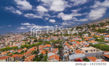 Aerial view from the mountain over the rooftops from cable car on Madeira timelapse hyperlapse. Aerial view from the mountain over the rooftops from cable car on Madeira timelapse hyperlapse. 141536350