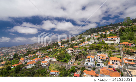 View from the mountain over the rooftops from cable car on Madeira timelapse hyperlapse. View from the mountain over the rooftops from cable car on Madeira timelapse hyperlapse. 141536351