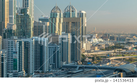 Dubai Marina skyscrapers aerial top view at sunrise from JLT in Dubai timelapse, UAE. 141536413