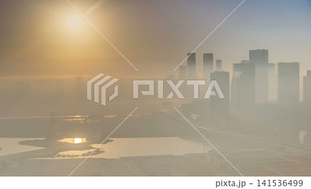 Abu Dhabi city skyline with skyscrapers at sunrise from above timelapse 141536499