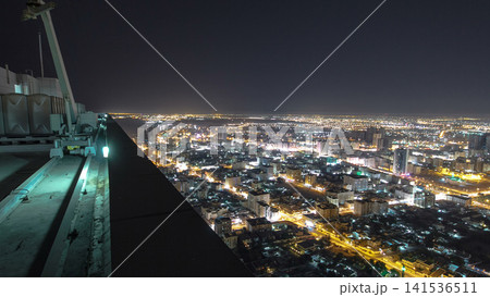Cityscape of Ajman from rooftop night aerial timelapse 141536511