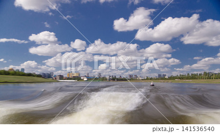 Astana, Kazakhstan. View from Pleasure boat on the river Ishim timelapse hyperlapse drivelapse in Astana. Astana, Kazakhstan. View from Pleasure boat on the river Ishim timelapse hyperlapse drivelapse in Astana. 141536540