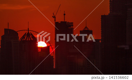 Dubai Marina skyscrapers from golf course sunset timelapse, Dubai, United Arab Emirates Dubai Marina skyscrapers from golf course sunset timelapse, Dubai, United Arab Emirates 141536602