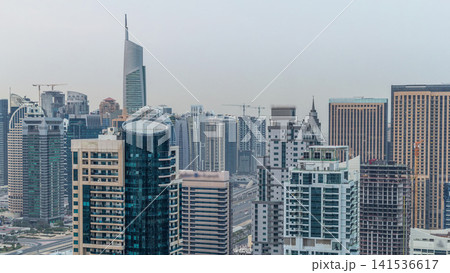 Aerial top view of Dubai Marina night to day timelapse. Modern towers and traffic on the road 141536617
