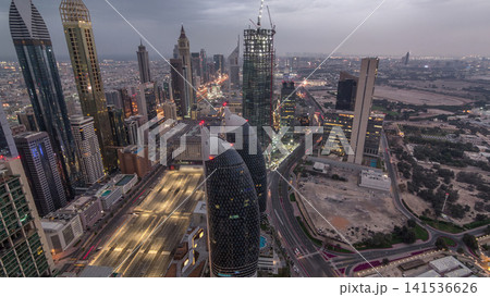 Skyline of the buildings of Sheikh Zayed Road and DIFC aerial night timelapse in Dubai, UAE. Skyline of the buildings of Sheikh Zayed Road and DIFC aerial night timelapse in Dubai, UAE. 141536626